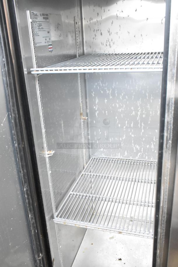 True T-35 stainless steel commercial cooler, two-door, with poly-coated racks, on casters. Model and spec labels visible.