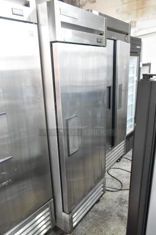 2019 True T-19F-HC stainless steel commercial freezer with poly-coated racks on casters, single door, good condition.