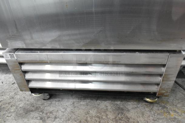 2019 True T-19F-HC stainless steel freezer, single door, poly-coated racks, commercial casters. Some surface wear visible.