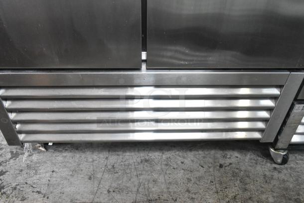 2022 True T-35-HC stainless steel commercial 2-door reach-in cooler, poly-coated racks, on casters, 115V, 1 phase.