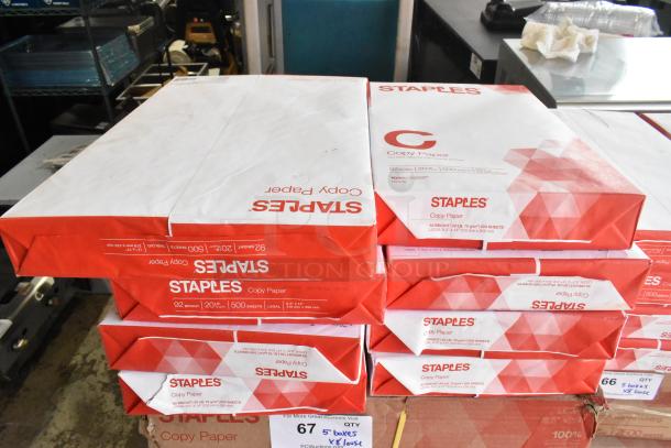 Five boxes of Staples copy paper with an additional eight reams. 92 bright, 20 lb, 500 sheets per ream.