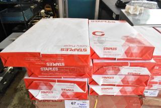Five boxes of Staples copy paper with an additional eight reams. 92 bright, 20 lb, 500 sheets per ream.