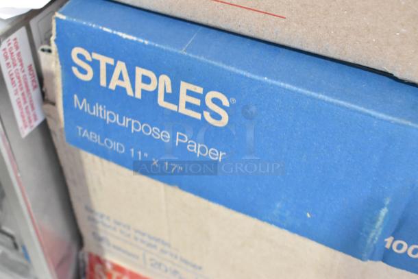 Boxes of Staples multipurpose paper, 11"x17" tabloid size. Includes 5 boxes plus 8 extra reams.