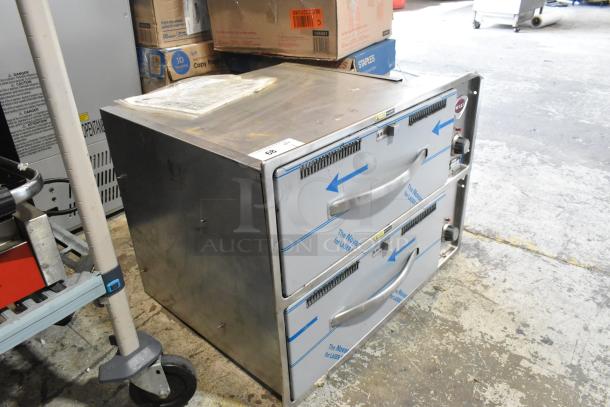 Brand new Wells RW26HD stainless steel 2-drawer warming drawer, 120V, 1 phase, with protective wrapping and minor dents.
