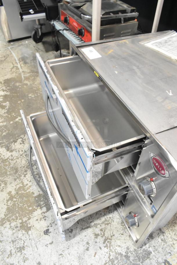 Brand new Wells RW26HD stainless steel 2-drawer warming drawer, 120V, 1 phase, slight dents, visible Wells logo and controls.