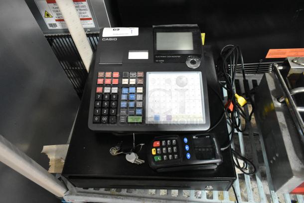 Casio SE-C3500 electronic cash register with keys and keypad. Features include color-coded buttons and a display. 120V, 1 phase.