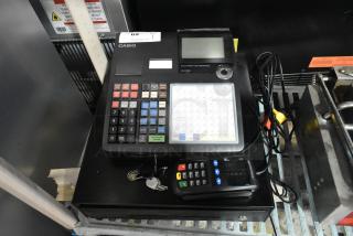 Casio SE-C3500 electronic cash register with keys and keypad. Features include color-coded buttons and a display. 120V, 1 phase.