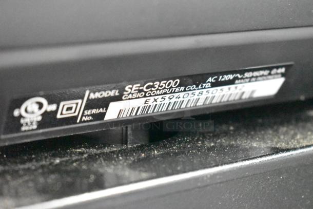 Casio SE-C3500 cash register label showing model, serial number EX594058505, and 120V power specs.