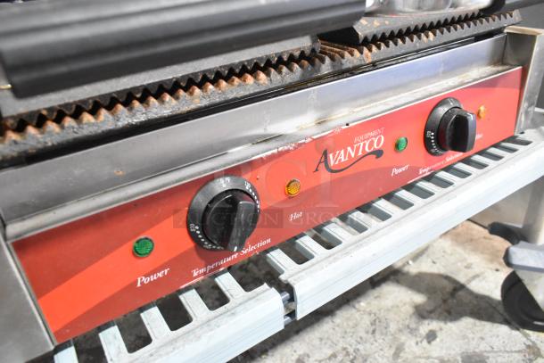 Avantco 177P84 Stainless Steel Double Panini Press, shows power and heat knobs, 120V, commercial use, visible wear.