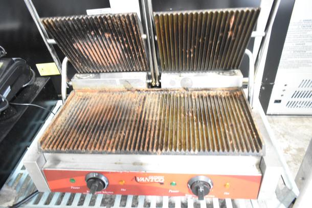 Avantco 177P84 stainless steel double panini press, used condition, 120V, 1 Phase, ribbed plates, dual controls visible.