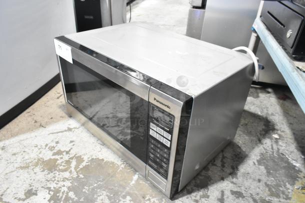 Panasonic NN-SN661S stainless steel countertop microwave oven with plate, model NN-SN661S, in used condition.