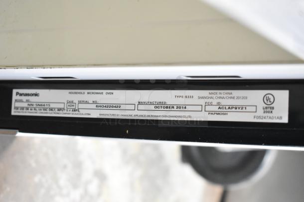 Panasonic NN-SN661S microwave oven label, detailing model, serial number 6H04220422, and manufacture date, October 2014.