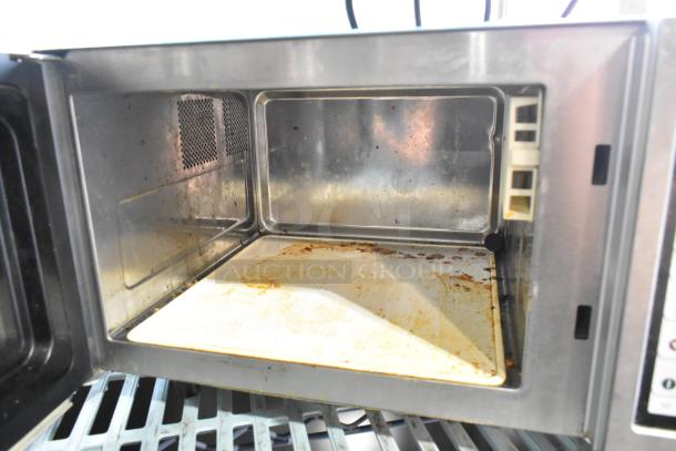 2017 Amana RMS10TS stainless steel countertop microwave, 120 volts, 1 phase, interior shows wear with some staining.