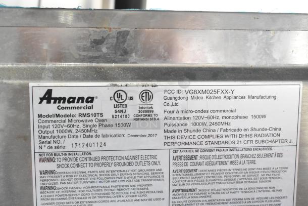 2017 Amana RMS10TS stainless steel countertop microwave oven, 120V, 1 phase, 1000W output. Label shows specs and safety info.