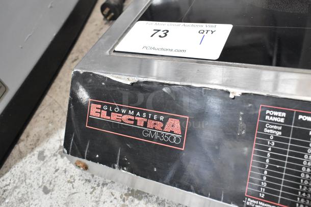 Glowmaster Electra GMI-3500 stainless steel induction range with label and power settings. Slight wear on edges. 208V, 1 Phase.