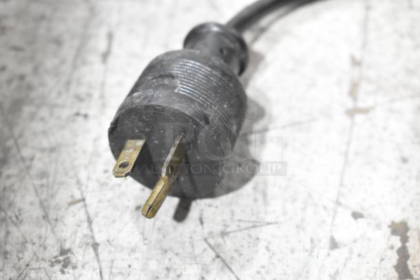 A close-up of a power plug for the Glowmaster Electra GMI-3500 induction range, suitable for 208 volts, 1 phase.