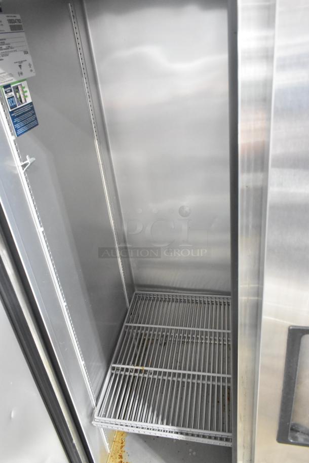 2020 True T-19F-HC stainless steel commercial reach-in freezer with poly coated racks, 115V, 1 phase, on casters.