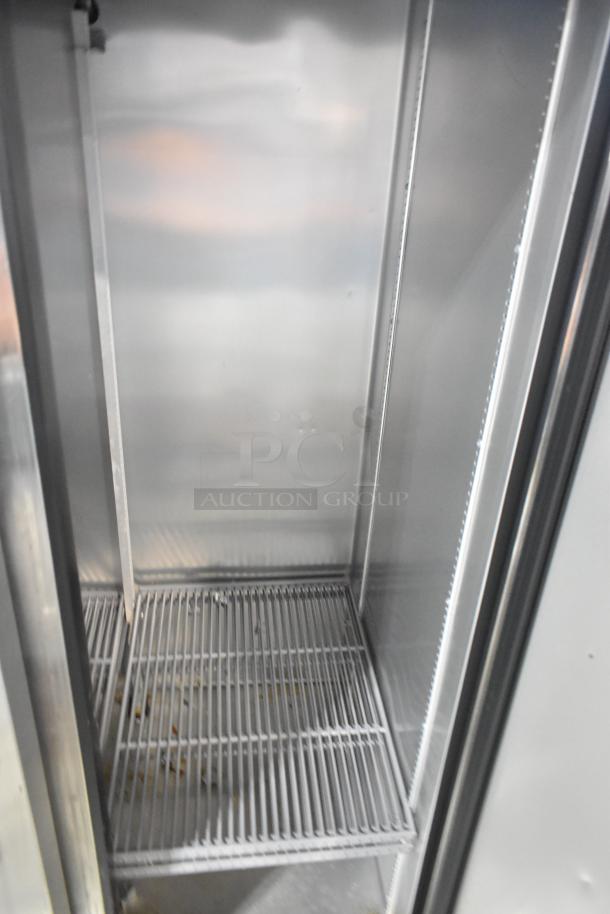 2020 True T-19F-HC single door stainless steel freezer, poly-coated racks, on casters, 115V, inside view, clean condition.
