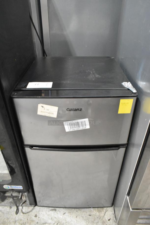 Galanz GLR31TS1E02 Mini Cooler with Freezer, shown with visible labels and minor wear, 115 Volts, 1 Phase.