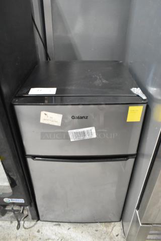 Galanz GLR31TS1E02 Mini Cooler with Freezer, shown with visible labels and minor wear, 115 Volts, 1 Phase.