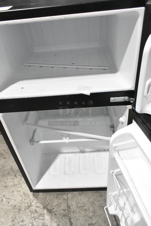 Galanz GLR31TS1E02 Mini Cooler with freezer, open view. 115 volts, 1 phase. Clean interior, minor wear.