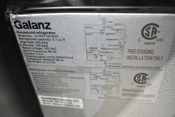 Galanz GLR31TS1E02 Mini Cooler with Freezer label showing model details, 3.1 cu. ft. capacity, 115 volts, 1 phase.