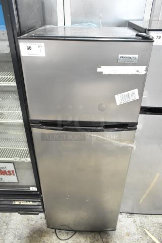 Frigidaire FGFR727 reach-in cooler with freezer, 115 volts, 1 phase. Visible wear and markings. Frigidaire Gallery label.