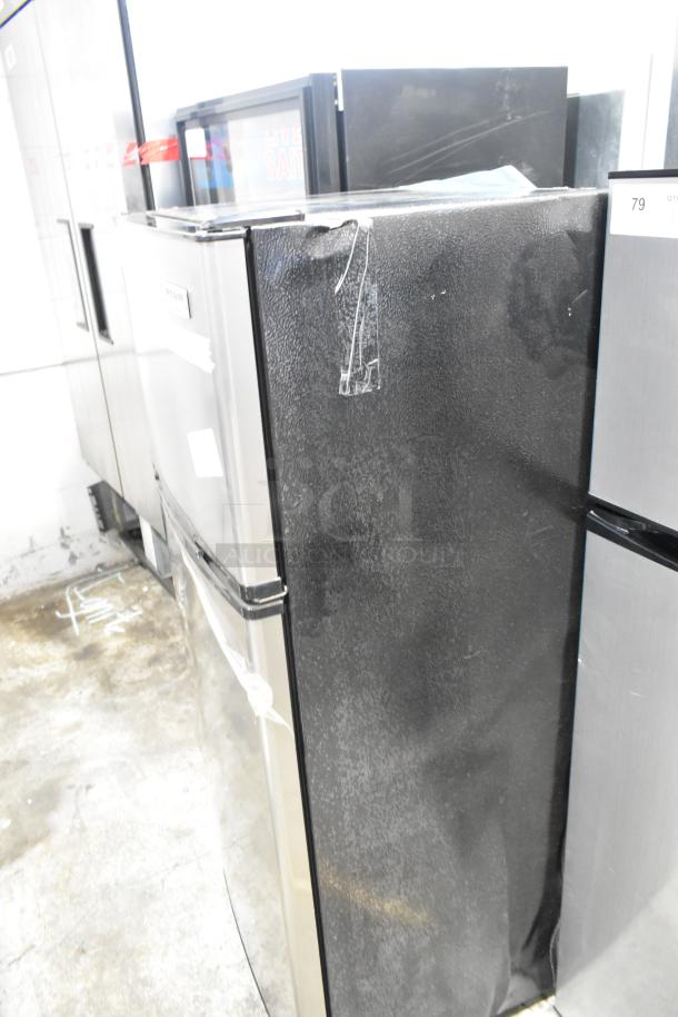 Frigidaire FGFR727 reach-in cooler with freezer, 115 volts, 1 phase. Some visible wear and taped areas.
