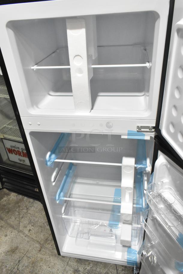 Frigidaire FGFR727 Reach-In Cooler and Freezer, new condition, 115 volts, 1 phase, interior shelving shown.