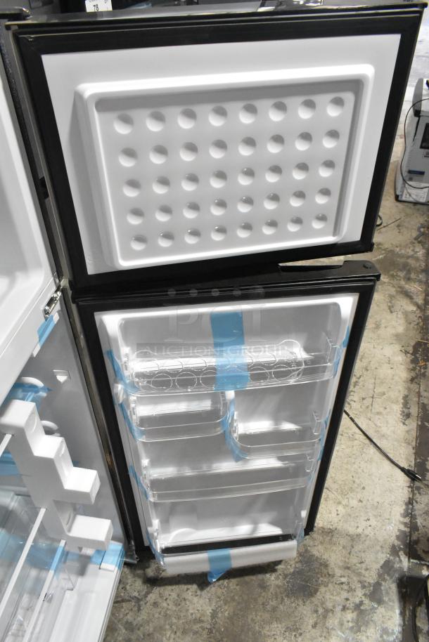 Frigidaire FGFR727 reach-in cooler with freezer, 115V, 1 phase, interior view showing shelves, like new condition.
