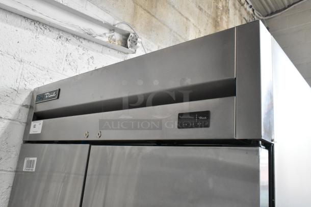 2019 True T-35-HC stainless steel 2-door reach-in cooler, digital display, on casters, with poly-coated racks.
