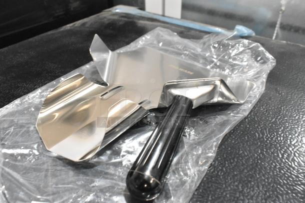 Brand new Pro Ware metal fry scoopers, scratch and dent, with black handles. Packaged in plastic, showing stainless steel construction.