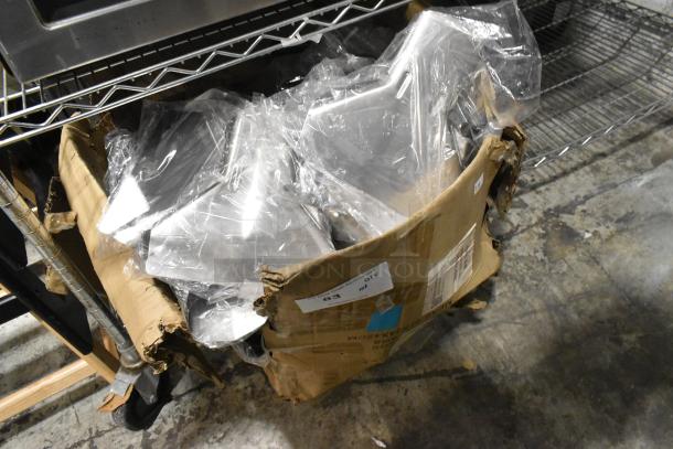 Lot of brand new, scratch and dent Pro Ware metal fry scoopers in damaged box, wrapped in clear plastic packaging.