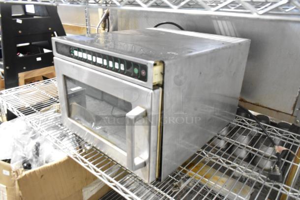 Menumaster MDC182 stainless steel commercial countertop microwave oven, 208/230 volts, 1 phase, visible wear on exterior.
