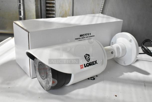 Lorex CVC7711PK4B camera with box, 700TVL 960H resolution, new condition, brand logo visible, ideal for home security.