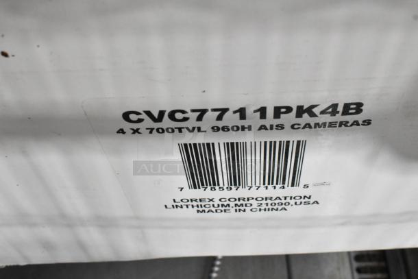 2 boxes of Lorex CVC7711PK4B cameras, 4 x 700TVL 960H. Made in China, by Lorex Corporation, Linthicum, MD USA.