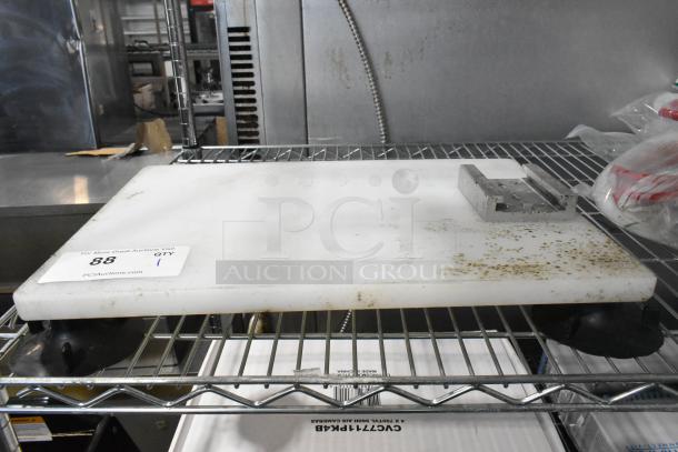 Nemco cutting board mount for vegetable slicer, showing moderate wear, metal bracket attached, auction tag with number 88 visible.