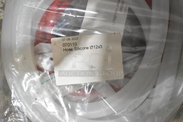 Lot of brand new silicone hoses and stacking kits, labeled "Hose Silicone Ø12x3," dated 07-08-2023. Sealed in plastic.