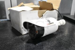 Lorex MC7711 AIS Camera in white, shown with original packaging. Features include a protective hood. In used condition.