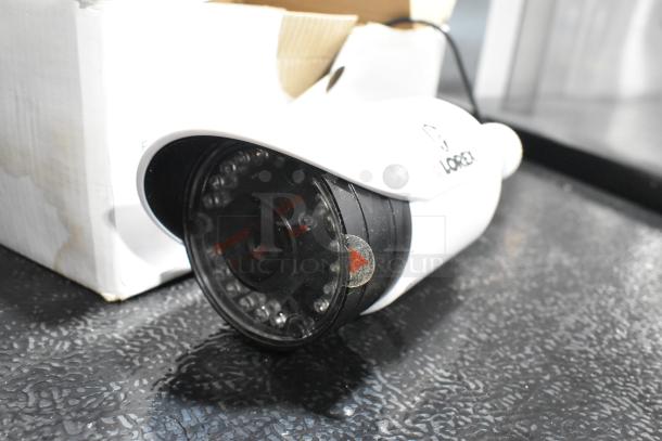 Lorex MC7711 AIS Camera, white, near-new condition, visible branding, protective film intact.