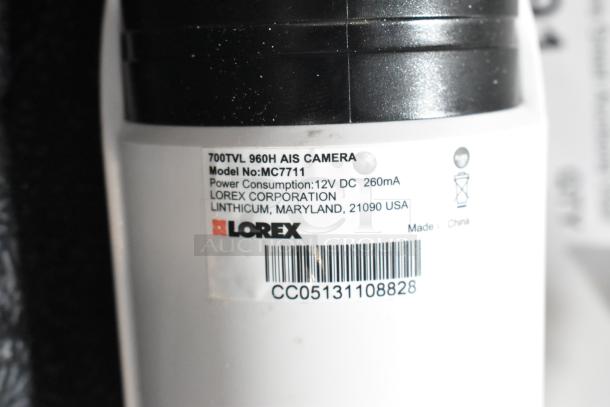 Lorex MC7711 AIS Camera, model MC7711, 700TVL 960H, 12V DC power, made in China, label with barcode visible.