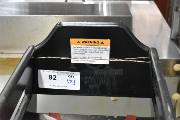 Three wooden high chairs with safety warnings. Includes auction label "92 QTY Vx3" for bid multiplier.
