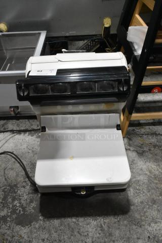 Toledo 3575EA Metal Countertop Scale, 110V, 1 Phase, in fair condition with visible wear. Auction label attached.