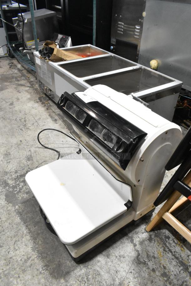 Toledo 3575EA Metal Countertop Scale, 110 Volts, 1 Phase. Good condition, features a durable metal body and clear display.