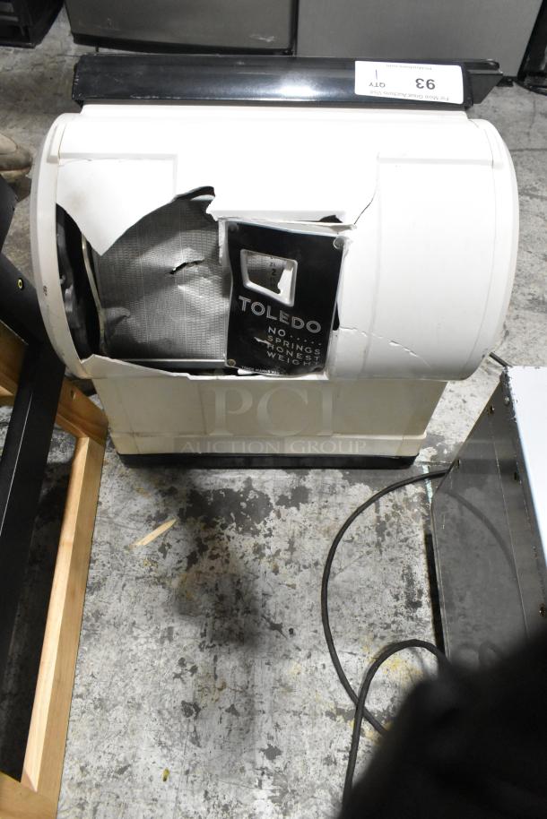 Toledo 3575EA metal countertop scale, 110V, 1 phase. Visible damage on the casing, "No Springs Honest Weight" label intact.