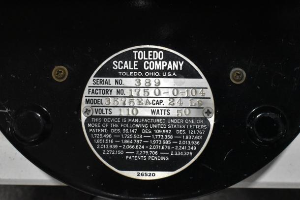Toledo 3575EA Metal Countertop Scale, 110V, 1 Phase, 24 lb capacity, Serial No. 389, factory tag with patent details.