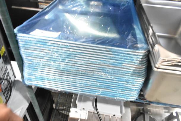 28 brand new scratch and dent items including 5 anti-jam stainless steel steam table pans and 23 aluminum bun pans.