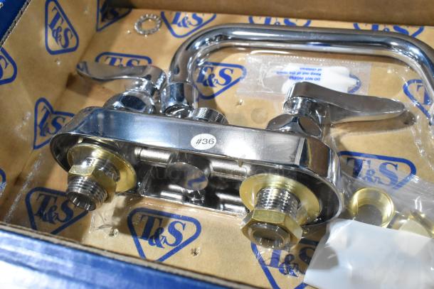 Brand new T&S B-1110 deck mounted faucet with 4" centers and 6" swing nozzle. Scratch and dent condition.