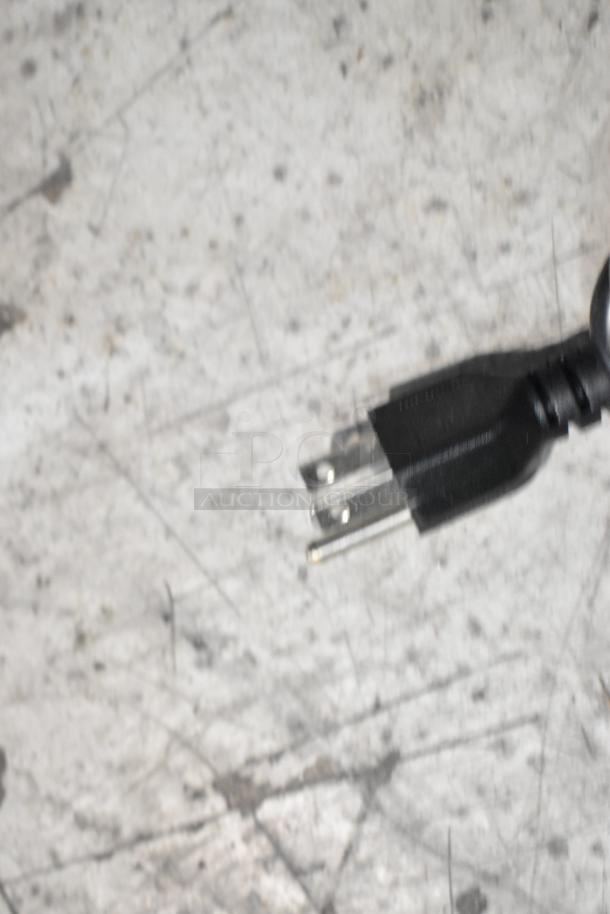 Close-up of a power plug on a new Town 56919NF 92-cup stainless steel electric rice warmer. 120 volts, 1 phase.