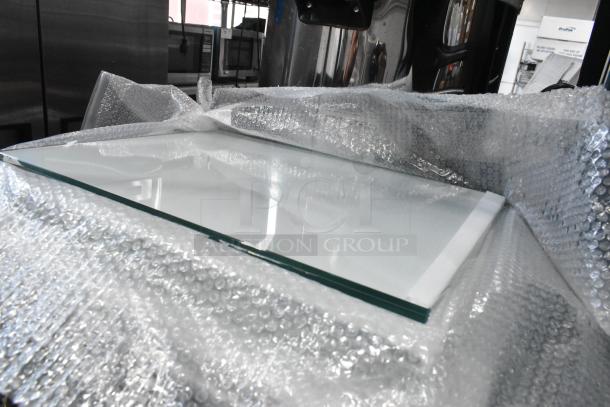 Six brand new scratch and dent glass panes, wrapped in bubble wrap, auctioned at 6 times your bid.